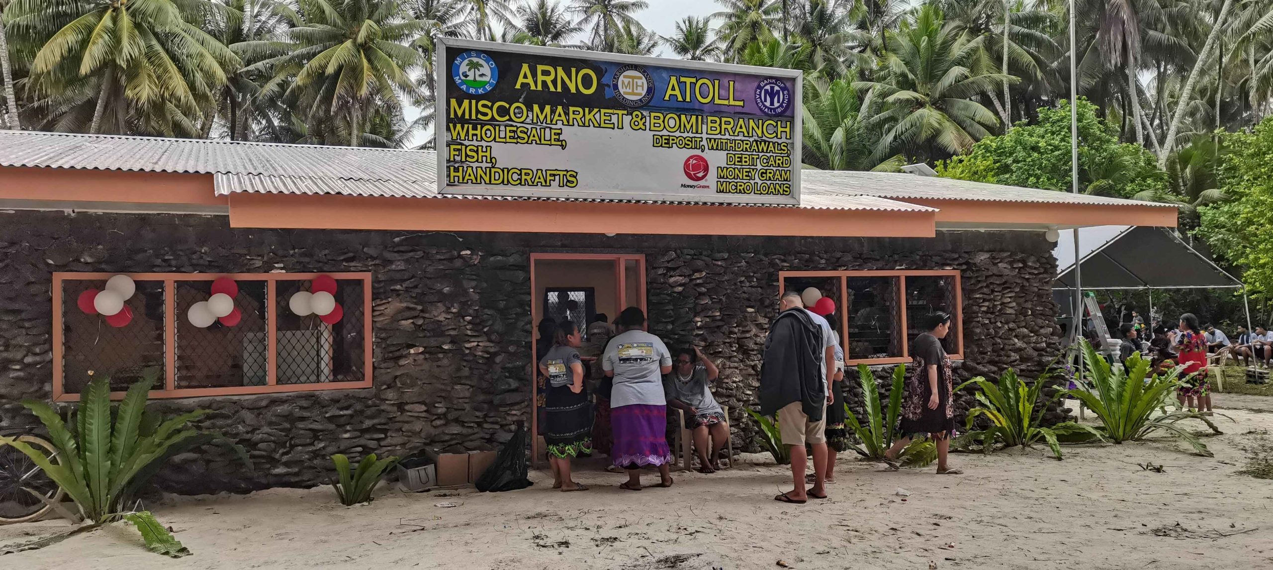 Residents standing in front of BOMI MISCo-Arno Branch